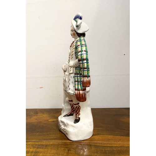 241 - A LARGE LATE 19TH CENTURY STAFFORDSHIRE FIGURE OF SIR WILLIAM WALLACE. The figure is standing on a s... 