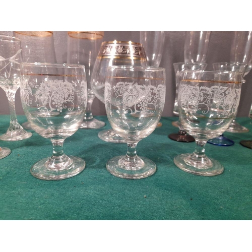 243 - A GREAT SELECTION OF VINTAGE GLASSES, in a variety of patterns and designs, including etched glasses... 