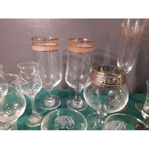 243 - A GREAT SELECTION OF VINTAGE GLASSES, in a variety of patterns and designs, including etched glasses... 