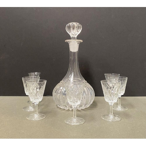 244 - A CUT GLASS DECANTER ALONG WITH SIX PORT/SHERRY GLASSES, the decanter of shaft and globe form with f... 