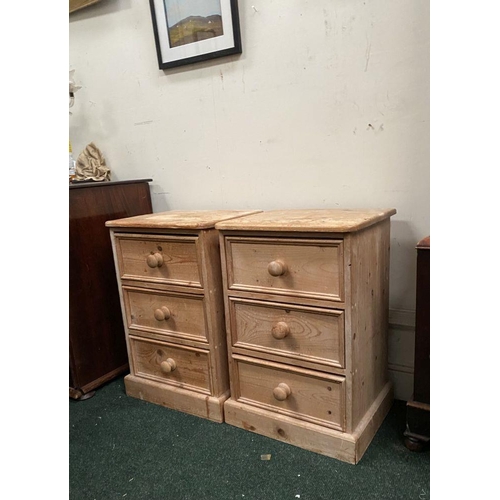 246 - A PAIR OF PINE THREE DRAWER BEDSIDE LOCKERS/CHESTS, three drawers raised on platform bases. Please n... 