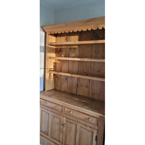 25 - A VERY GOOD IRISH PITCH PINE DRESSER, with pediment top over 3 open shelves; each with a raised lip ... 