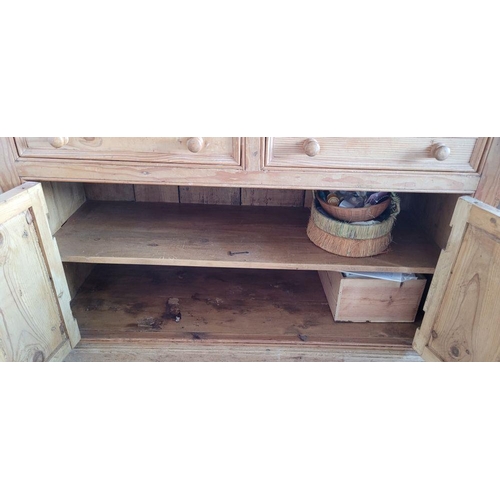 25 - A VERY GOOD IRISH PITCH PINE DRESSER, with pediment top over 3 open shelves; each with a raised lip ... 