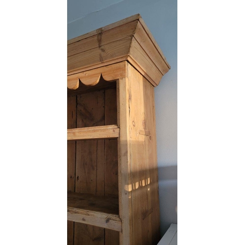 25 - A VERY GOOD IRISH PITCH PINE DRESSER, with pediment top over 3 open shelves; each with a raised lip ... 