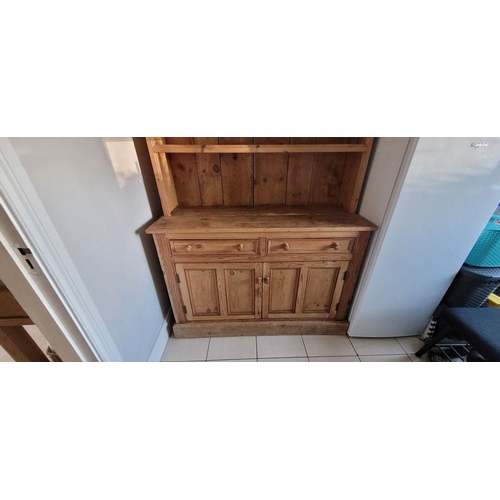 25 - A VERY GOOD IRISH PITCH PINE DRESSER, with pediment top over 3 open shelves; each with a raised lip ... 