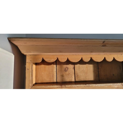 25 - A VERY GOOD IRISH PITCH PINE DRESSER, with pediment top over 3 open shelves; each with a raised lip ... 