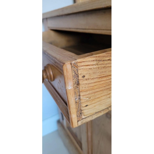 25 - A VERY GOOD IRISH PITCH PINE DRESSER, with pediment top over 3 open shelves; each with a raised lip ... 