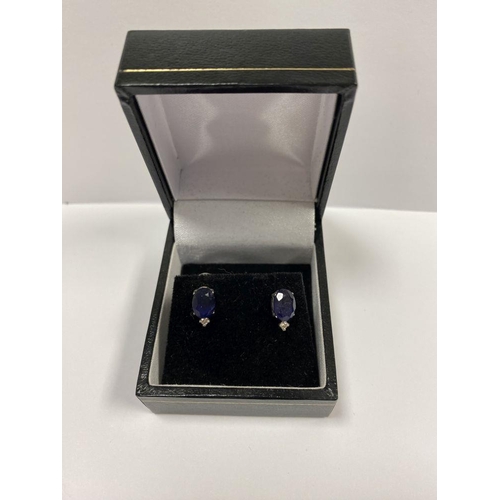 28 - A PAIR OF 18CT GOLD SAPPHIRE DIAMOND STUD EARRINGS, with oval cut sapphires in four prong claw setti... 