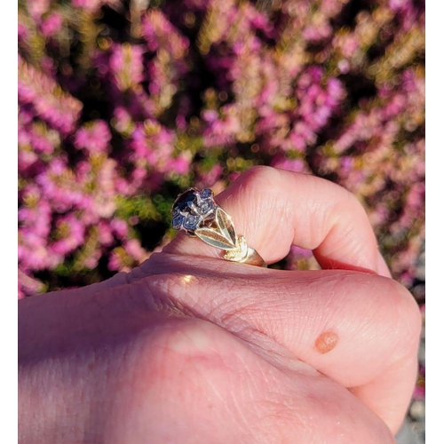 32 - A BEAUTIFUL VINTAGE 18CT YELLOW GOLD SAPPHIRE & DIAMOND DRESS RING, with a central oval shaped dark ... 