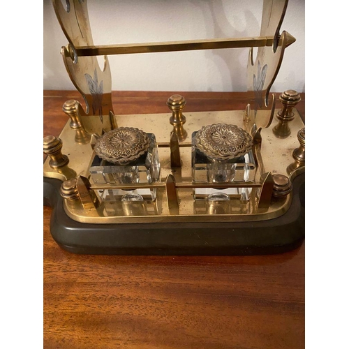 35 - AN UNUSUAL & GOOD QUALITY POLISHED BRASS & MARBLE DESK SET, with two foliate style uprights having s... 