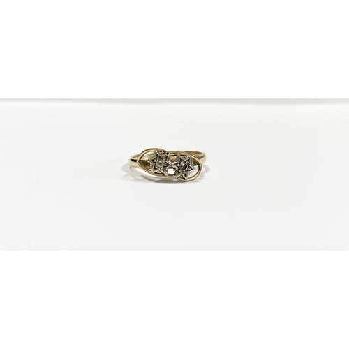 36 - A PRETTY 9CT YELLOW GOLD TWO STONE DIAMOND RING, with two round cut diamonds in decorative star sett... 