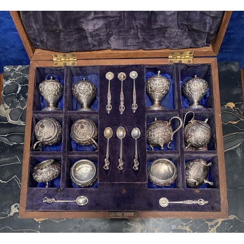 37 - AN EXCELLENT CASED INDIAN SILVER CONDIMENT SET, c.1890, to include four salts, four mustard pots and... 