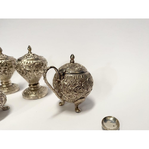 37 - AN EXCELLENT CASED INDIAN SILVER CONDIMENT SET, c.1890, to include four salts, four mustard pots and... 