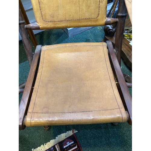 44 - A GOOD PAIR OF LEATHER UPHOLSTERED CAMPAIGN CHAIRS, folding campaign chairs with leather backrest an... 