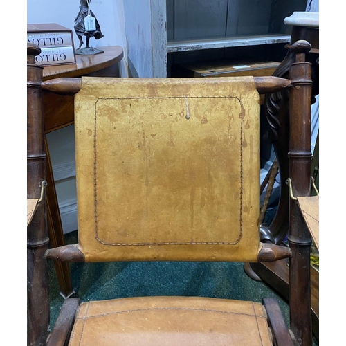 44 - A GOOD PAIR OF LEATHER UPHOLSTERED CAMPAIGN CHAIRS, folding campaign chairs with leather backrest an... 