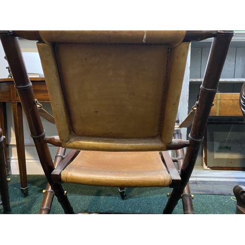 44 - A GOOD PAIR OF LEATHER UPHOLSTERED CAMPAIGN CHAIRS, folding campaign chairs with leather backrest an... 