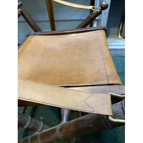 44 - A GOOD PAIR OF LEATHER UPHOLSTERED CAMPAIGN CHAIRS, folding campaign chairs with leather backrest an... 