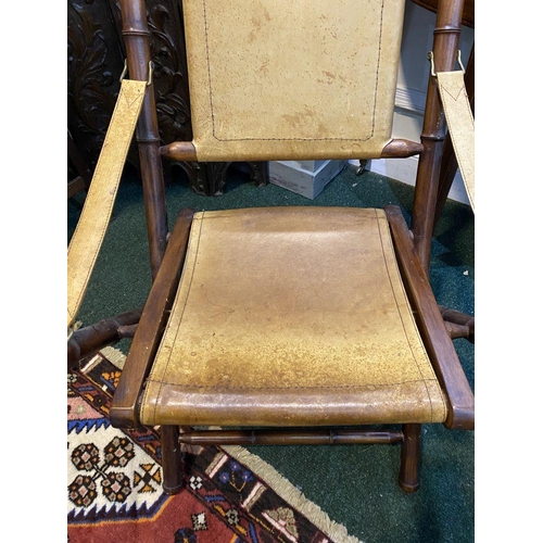 44 - A GOOD PAIR OF LEATHER UPHOLSTERED CAMPAIGN CHAIRS, folding campaign chairs with leather backrest an... 