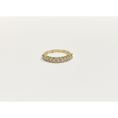 45 - A STUNNING 18CT YELLOW GOLD DIAMOND ETERNITY RING, with eleven round cut diamonds graduating in size... 