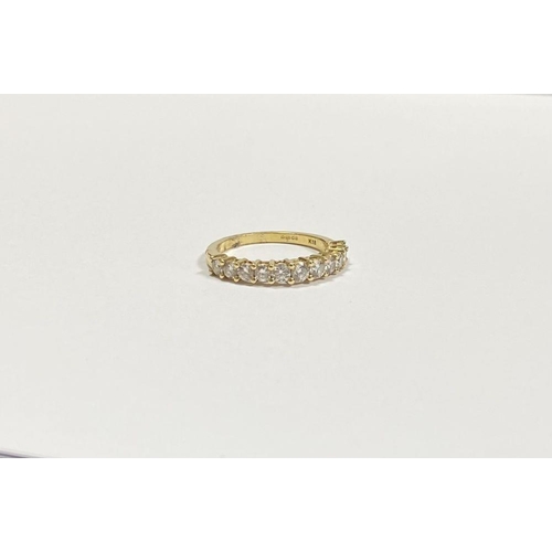 45 - A STUNNING 18CT YELLOW GOLD DIAMOND ETERNITY RING, with eleven round cut diamonds graduating in size... 