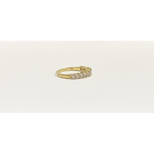 45 - A STUNNING 18CT YELLOW GOLD DIAMOND ETERNITY RING, with eleven round cut diamonds graduating in size... 