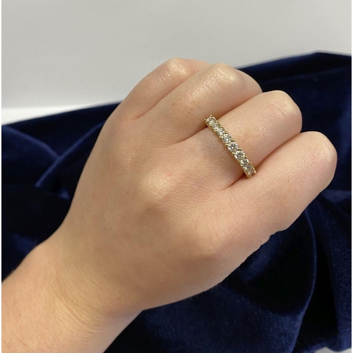 45 - A STUNNING 18CT YELLOW GOLD DIAMOND ETERNITY RING, with eleven round cut diamonds graduating in size... 