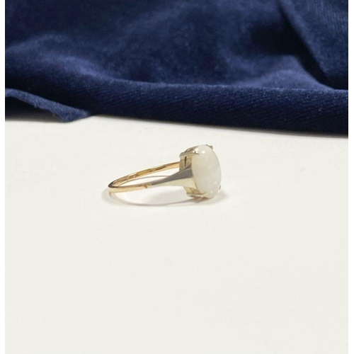 55 - AN ELEGANT 9CT YELLOW GOLD OPAL SOLITAIRE RING, with oval cut opal in raised four prong claw setting... 