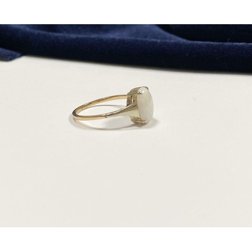 55 - AN ELEGANT 9CT YELLOW GOLD OPAL SOLITAIRE RING, with oval cut opal in raised four prong claw setting... 