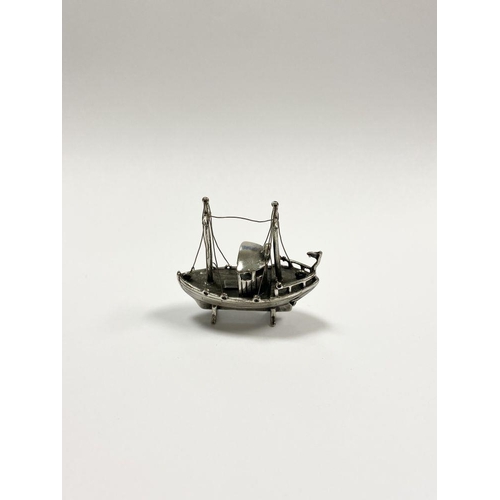 57 - A CHARMING STERLING SILVER MINIATURE FISHING BOAT, Hallmarked with European assay mark and marked 92... 