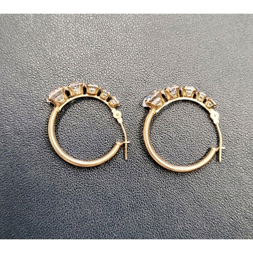 58 - A GREAT PAIR OF 9CT YELLOW GOLD WHITE SAPPHIRE HOOP STYLE EARRINGS, with graduated setting of 5 whit... 