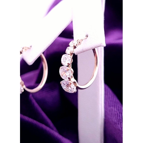 58 - A GREAT PAIR OF 9CT YELLOW GOLD WHITE SAPPHIRE HOOP STYLE EARRINGS, with graduated setting of 5 whit... 