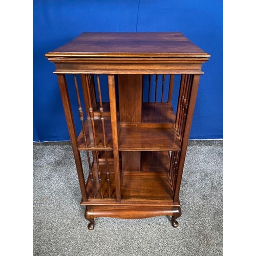 59 - A GOOD MAHOGANY REVOLVING FLOOR BOOKCASE, the edge has a stepped side that rests upon the open bookc... 