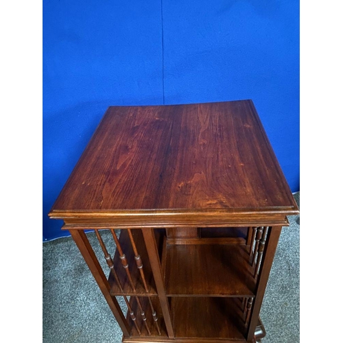 59 - A GOOD MAHOGANY REVOLVING FLOOR BOOKCASE, the edge has a stepped side that rests upon the open bookc... 