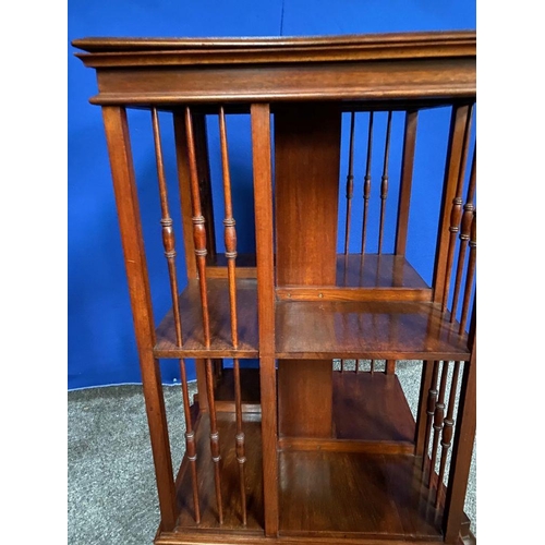 59 - A GOOD MAHOGANY REVOLVING FLOOR BOOKCASE, the edge has a stepped side that rests upon the open bookc... 