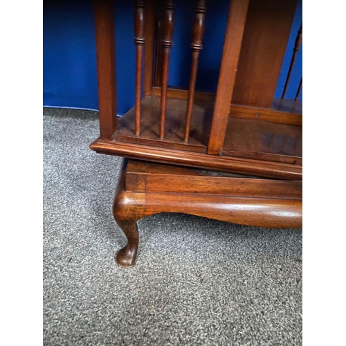 59 - A GOOD MAHOGANY REVOLVING FLOOR BOOKCASE, the edge has a stepped side that rests upon the open bookc... 