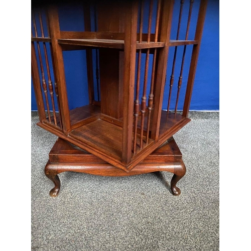 59 - A GOOD MAHOGANY REVOLVING FLOOR BOOKCASE, the edge has a stepped side that rests upon the open bookc... 