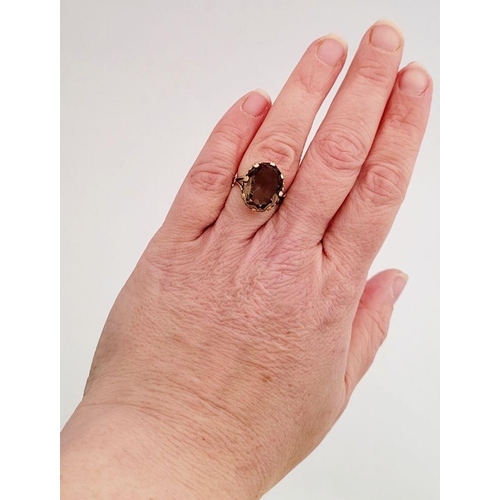 62 - A FANTASTIC VINTAGE 9CT YELLOW GOLD SMOKEY QUARTZ RING, the large oval shaped quartz is set within a... 