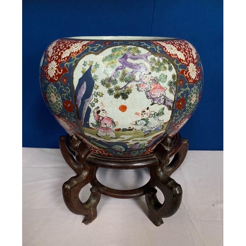 65 - A CHINESE PORCELAIN GLAZED PICTURE PANEL ‘FISH BOWL’ JARDINERÉ POT, raised on a carved hard wood sta... 