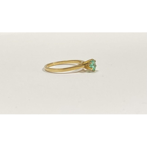 69 - A PRETTY 18CT YELLOW GOLD OVAL CUT EMERALD SOLITAIRE RING, with oval cut emerald in raised six prong... 