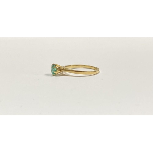 69 - A PRETTY 18CT YELLOW GOLD OVAL CUT EMERALD SOLITAIRE RING, with oval cut emerald in raised six prong... 