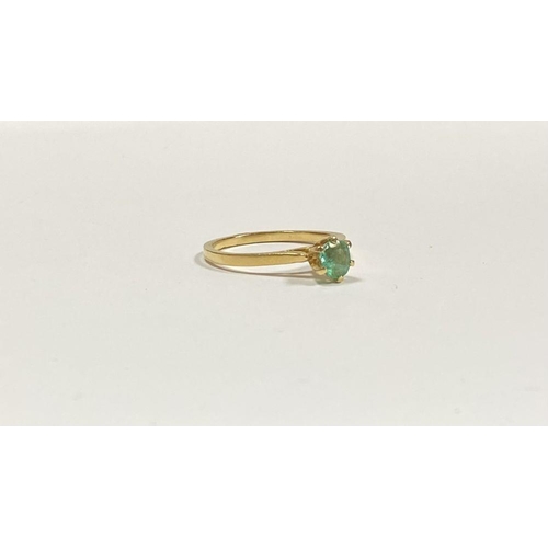 69 - A PRETTY 18CT YELLOW GOLD OVAL CUT EMERALD SOLITAIRE RING, with oval cut emerald in raised six prong... 