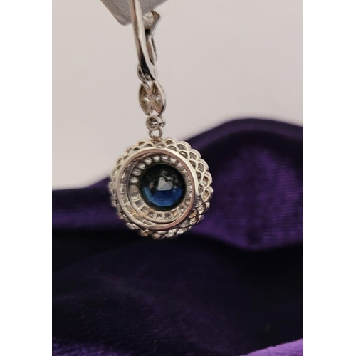 7 - A FANTASTIC PAIR OF ANTIQUE SAPPHIRE & DIAMOND DROP EARRINGS, circa 1920s, with a central round dark... 