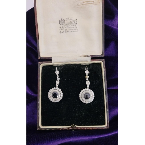 7 - A FANTASTIC PAIR OF ANTIQUE SAPPHIRE & DIAMOND DROP EARRINGS, circa 1920s, with a central round dark... 