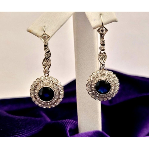 7 - A FANTASTIC PAIR OF ANTIQUE SAPPHIRE & DIAMOND DROP EARRINGS, circa 1920s, with a central round dark... 