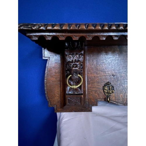 76 - A VERY NICE CARVED OAK HANGING HALL/COAT STAND, with carved border to top which can be used as shelf... 