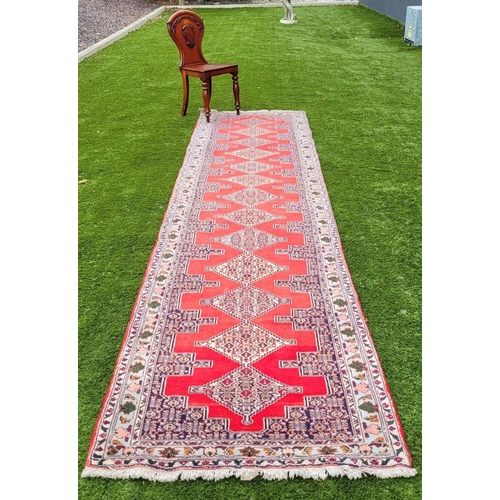 77 - A BEAUTIFUL PERSIAN SENNEH RUNNER RUG, double knotted, dense pile. This rug was created in the Kurdi... 