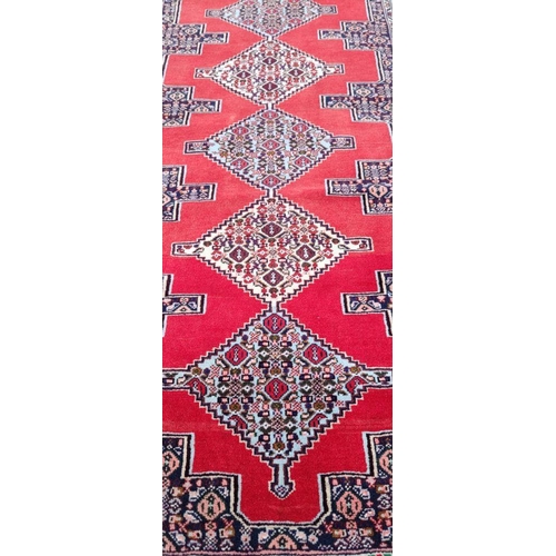 77 - A BEAUTIFUL PERSIAN SENNEH RUNNER RUG, double knotted, dense pile. This rug was created in the Kurdi... 