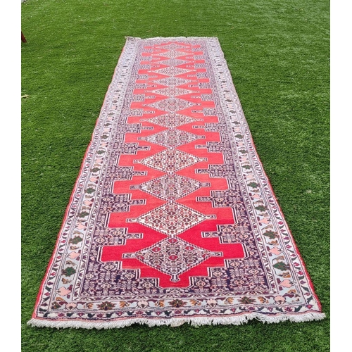 77 - A BEAUTIFUL PERSIAN SENNEH RUNNER RUG, double knotted, dense pile. This rug was created in the Kurdi... 