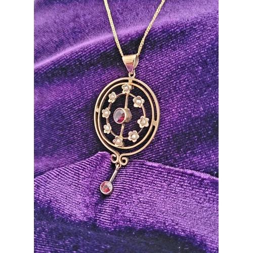 8 - A BEAUTIFUL EDWARDIAN 9CT YELLOW GOLD GARNET & SEED PEARL PENDANT WITH GOLD CHAIN, the pendant is a ... 