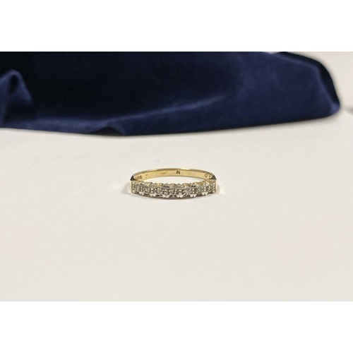 80 - A 9CT YELLOW GOLD SEVEN STONE DIAMOND RING, with seven round cut diamonds in raised illusion setting... 